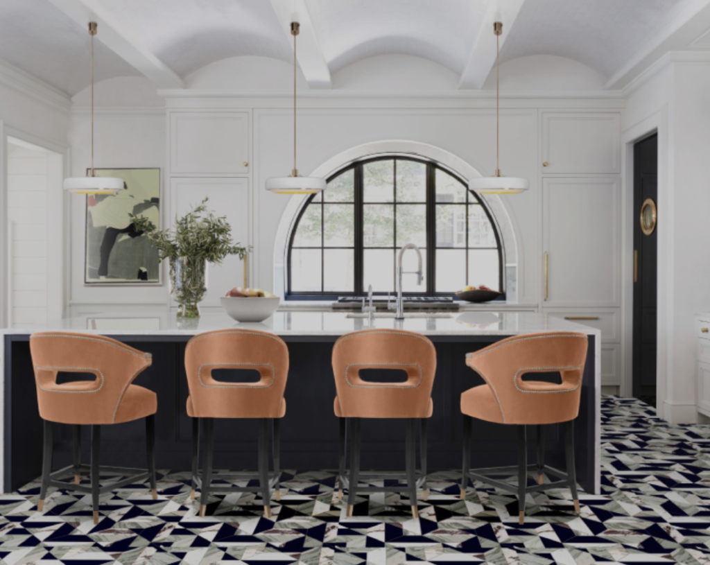 Peach counter stools on a black and white tile floor.